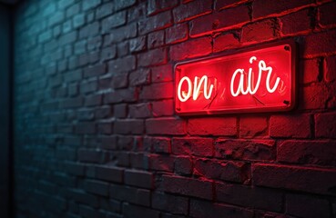 Neon sign reading on air mounted brick wall. Illuminated radio studio sign. Bright red light, broadcasting background. Radio station interior, podcast, streaming entertainment. Communication concept.