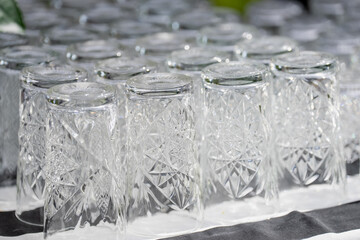 White transparent cocktail glasses upside down after being washed ready for cocktail drinking in...