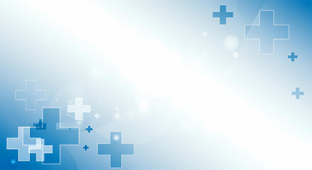 Obraz premium Floating blue crosses on a gradient white and blue backdrop, suggesting healthcare