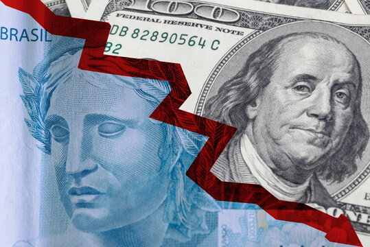 Brazilian currency note and US dollar with negative market graph in the composition. Concept of Brazilian and American economy, taxes, fees and finance.