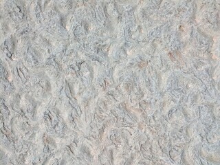 A gray-blue background of a rough rocky surface with a variety of shapes. For use as backgrounds...