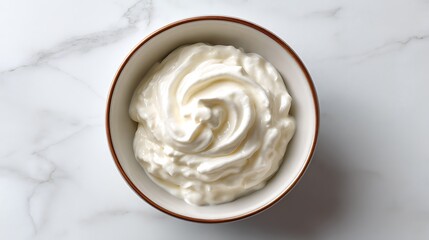Whipped Cream in a Ceramic Bowl on Marble Surface