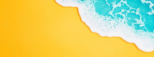 Beach wave with white foam on yellow sand background. Summer vacation and coastal holiday concept. Image for summer advertising, banner, sales promotion and marketing materials with copy space