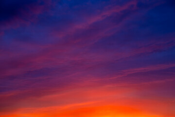 Evening sky with deep purple and orange hues against the setting sun