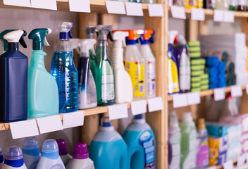 Assortment of kitchen and window cleaning products in the household goods department of a supermarket