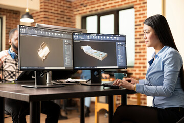 Professional female engineer manufacturing machinery models with advanced CAD software. Asian woman...