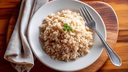 Steaming Brown Rice Served on a White Plate with a Fork