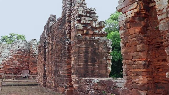 Interior view from the center of San Ignacio ancient church in Misiones. Shows the width of the ruined walls; camera pans to the altar area, now tourist paths