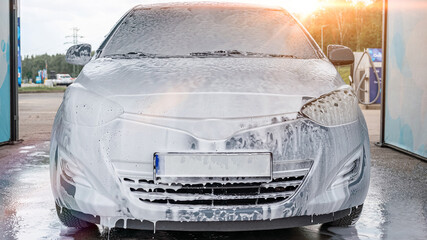 Spray car wash. Foam water bubbles soap. Self service detail pressure wet.