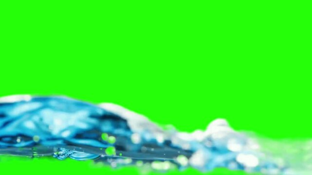 4K Video: Water dances and splashes on the vibrant chroma key backdrop, a captivating interplay of fluidity and light. It's a visual feast that captures the essence of movement.