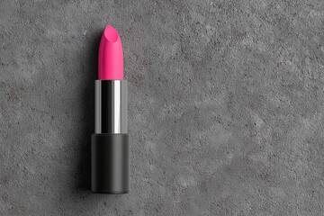 Hot pink lipstick on gray concrete © mattegg