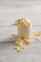 Protein powder scoop. Food beauty and health supplement closeup
