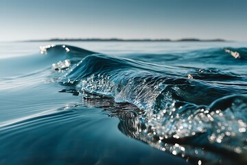 Closeup of Ocean Wave Cresting in Sunlight with Peaceful Water Reflection.