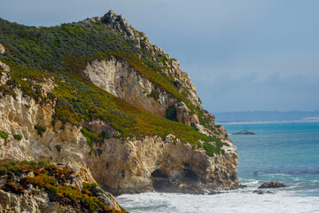 A mountain in San Luis Obispo and you can see a cave through the distance. 