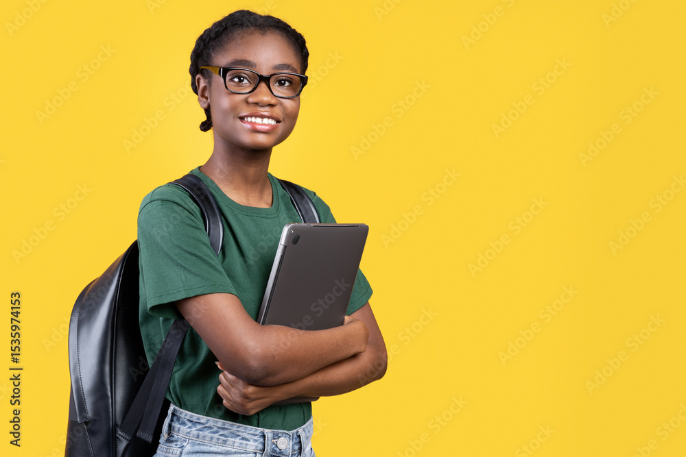 Aufkleber Smiling African Female Student Holding Laptop Hugging Computer Posing Standing On Yellow Studio Background. E-Learning And Educational Gadgets, Distant Online Study And Student's Lifestyle Concept