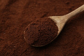 Instant coffee powder and spoon, closeup view