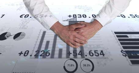 Hovering businessman clasping hands displaying bar charts, pie gauges and Euro data in office