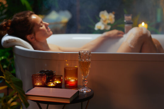 Fototapeta Peaceful Evening Bath with Book and Bubbles