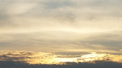 beautiful sunrise, with yellowish white clouds