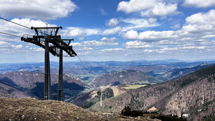 Spectacular mountain view with towers of cable car bringing tourist for hiking in summer and for skying and snowboarding in winter on Chleb over Vratna dolina in Mala Fatra in Slovakia © K&M FEHR