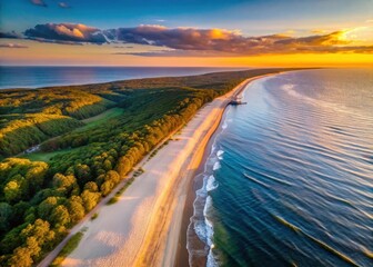 Drone view of Bansin beach at sunset over the island of Usedom with the Baltic Sea in the background