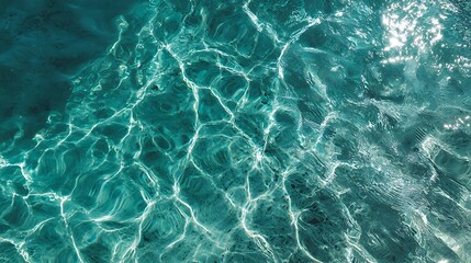 Obraz premium Abstract Turquoise Water Texture with Sunlight Reflections Creating a Calming and Refreshing Visual 
