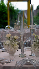 Wedding table. Plates. Flowers