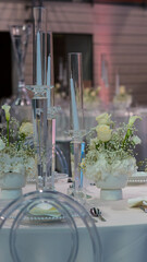 Wedding table. Plates, Flowers