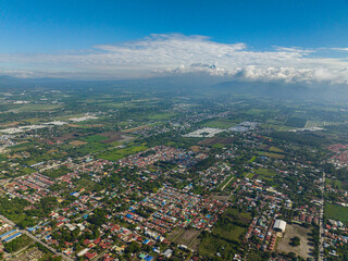 Above view of city and farm lard in tropical island. General Santos in Mindanao, Philippines. Cityscape.