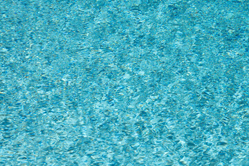 Background of pool waves. Water wave. Background of pool water surface. Background texture. Water in swimming pool. Rippled water texture.