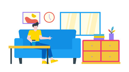 Man sitting on blue couch points to yellow dresser. Suitable for home decor, interior design, furniture store promotions, or apartment rental ads.