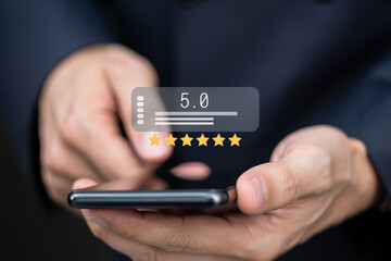 Person using smartphone to give a five star rating online review