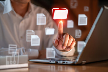 Businessman Accessing Digital Documents and Files on Laptop