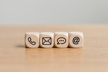 Wooden Cubes with Contact Us Icons Phone Email Chat At Symbol
