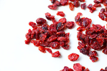 Dried cranberries piled on a white background