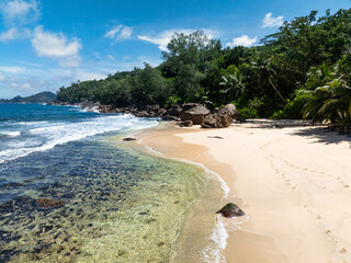 Beautiful beach in the tropics. Seychelles, Mahe. Anse Takamaka Beach.