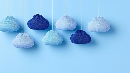 Knitted clouds in varying shades of blue.