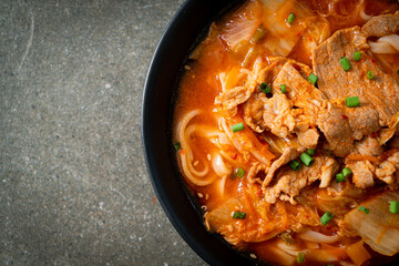 Korean udon ramen noodles with pork in kimchi soup