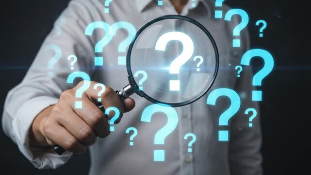 Question mark and root cause analysis concept. A hand holding a magnifying glass over large question marks surrounded by smaller ones symbolizes cause analysis and problem-solving. solution, analyze