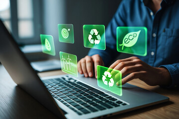 Person using laptop with green eco friendly technology interface