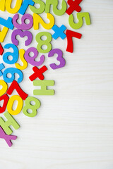 Colorful Numbers and Letters on Wooden Table with Copy Space