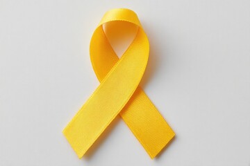 minimalistic image of single yellow ribbon on plain white background symbolizes hepatitis awareness and world hepatitis