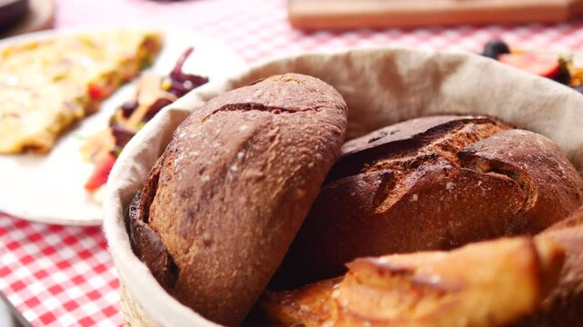 Freshly baked bread in a rustic basket on the table
