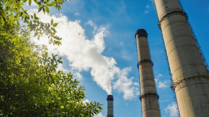 Industrial smoke emission monitoring urban power plant clear sky low angle environmental impact awareness