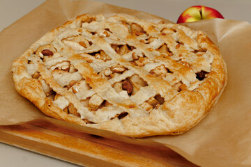 Homemade apple pie on dark rustic background, top view. Classic autumn dessert