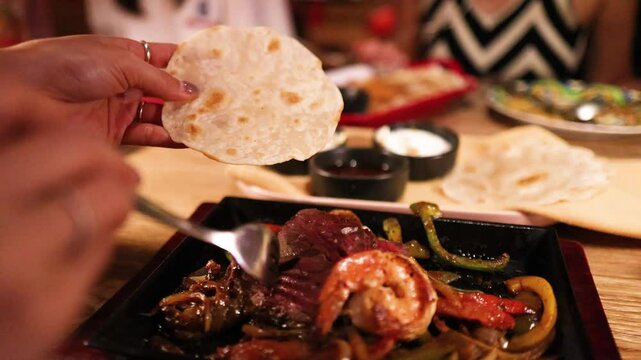 Preparing Tlayudas with Grilled Meat and Vegetables