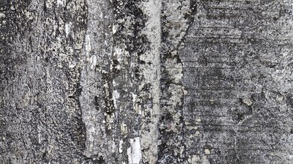 Stone wall with rough concrete surface and distressed grunge textures, vintage-style background...