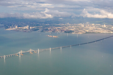 Beautiful view from above of the Penang Bridge over Penang Strait and cityscape of Butterworth in Penang, Malaysia