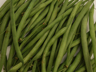 Common beans piled on white background