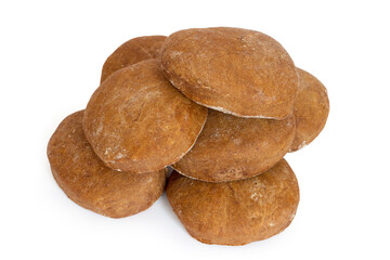 A pile of homemade chocolate gingerbread on a white background. Brown homemade cookies.